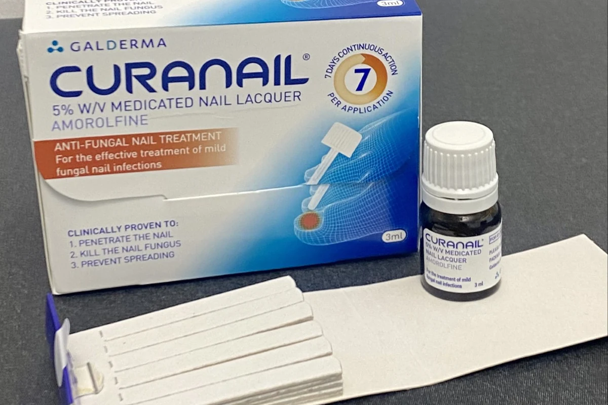 A topical antifungal nail lacquer kit with applicators and a small medication bottle.